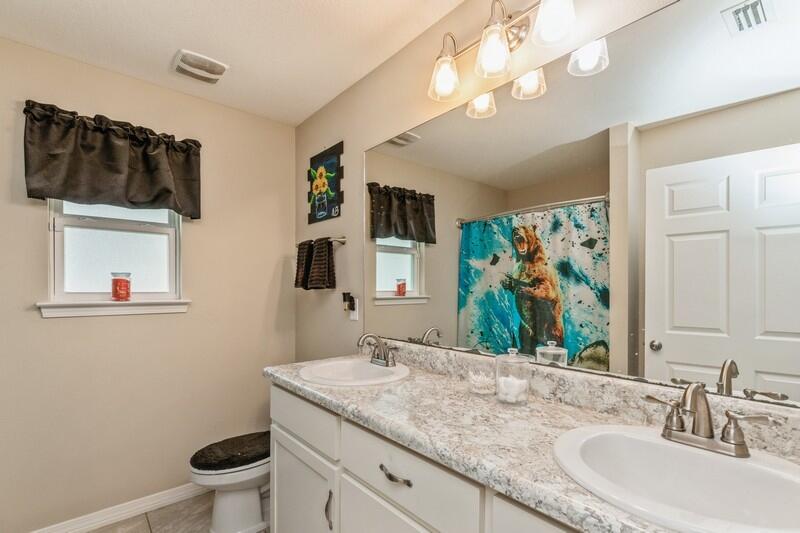 3152 Vaccari Court Crestview, FL 32539 - Photo 21 of 36 a bathroom with a granite countertop sink and a mirror