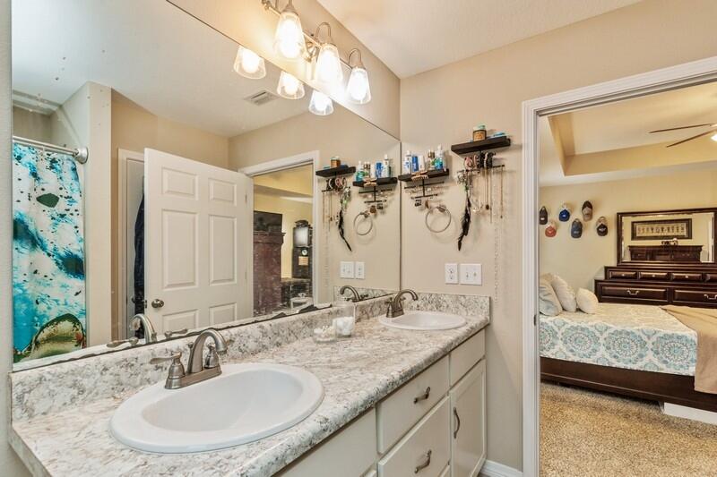 3152 Vaccari Court Crestview, FL 32539 - Photo 22 of 36 a en suite bathroom with a double vanity sink and a mirror