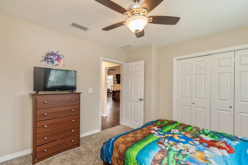 3152 Vaccari Court Crestview, FL 32539 - Photo 24 of 36 a bedroom with a bed and a flat screen tv