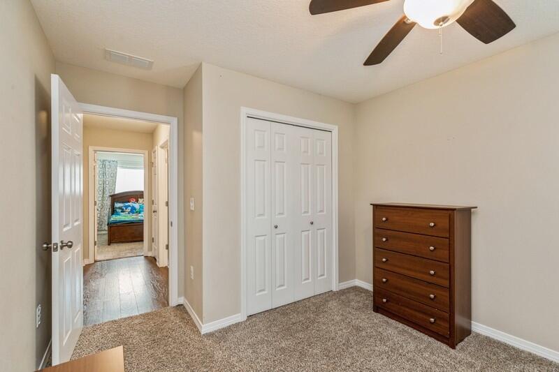 3152 Vaccari Court Crestview, FL 32539 - Photo 28 of 36 a view of walk in closet with wooden floor