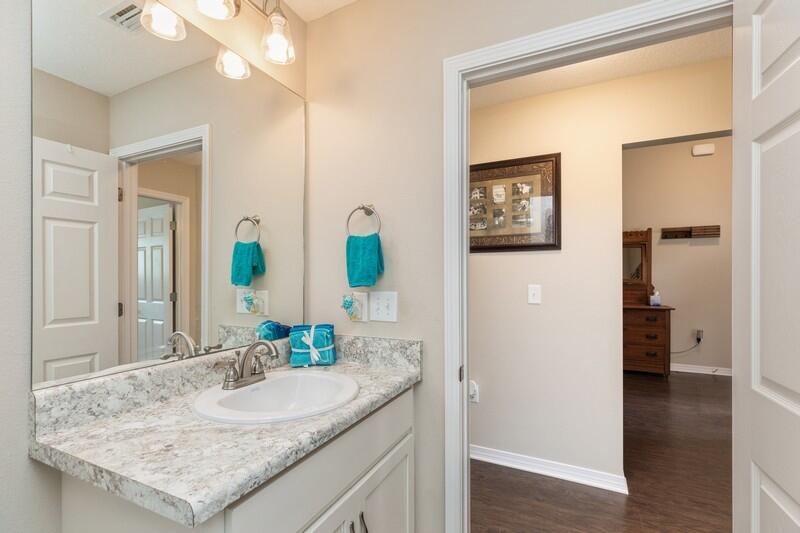 3152 Vaccari Court Crestview, FL 32539 - Photo 30 of 36 a bathroom with a granite countertop sink and a mirror