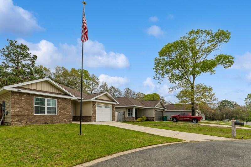 3152 Vaccari Court Crestview, FL 32539 - Photo 4 of 36 a front view of a house with a yard