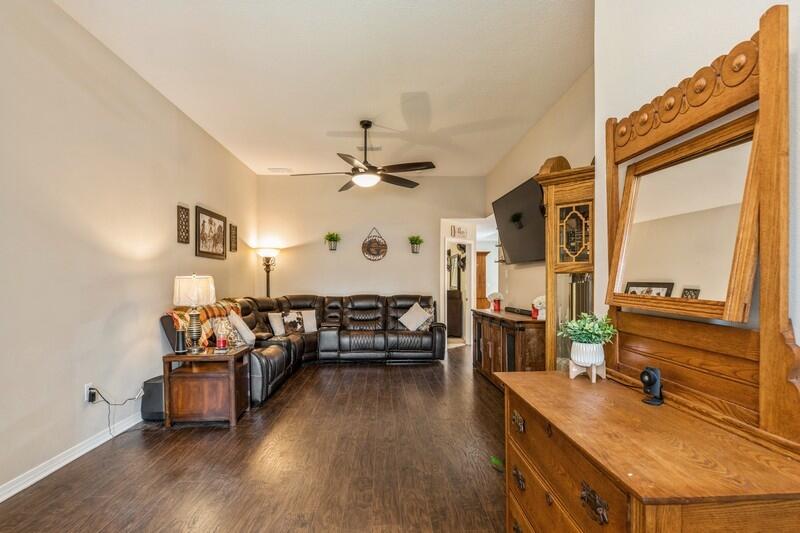 3152 Vaccari Court Crestview, FL 32539 - Photo 5 of 36 a living room with furniture and wooden floor