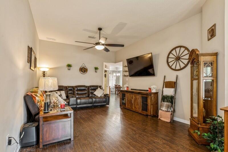 3152 Vaccari Court Crestview, FL 32539 - Photo 6 of 36 a living room with furniture and a flat screen tv