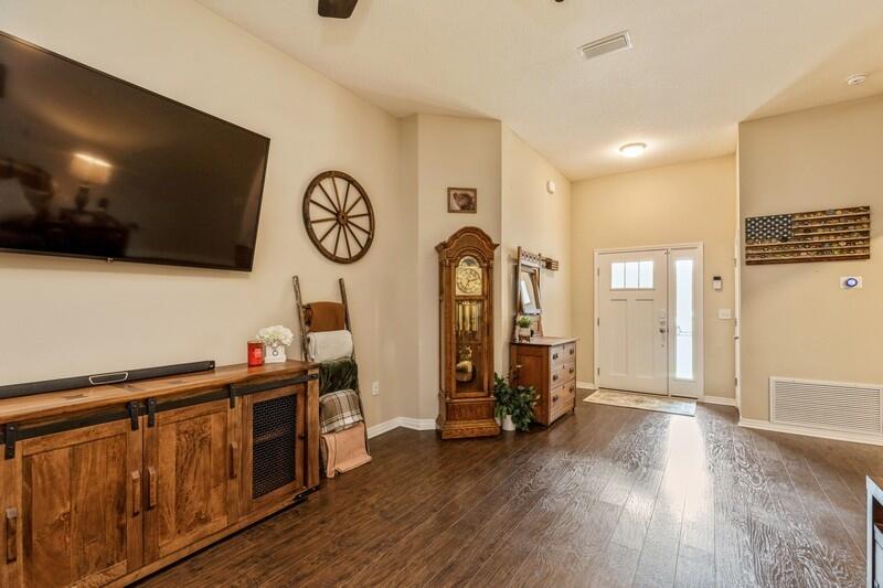 3152 Vaccari Court Crestview, FL 32539 - Photo 7 of 36 a view of room with furniture and wooden floor