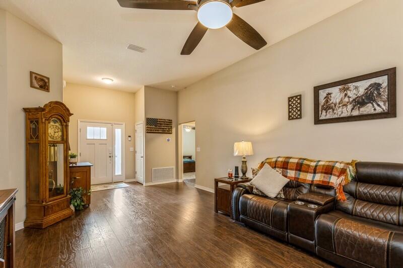 3152 Vaccari Court Crestview, FL 32539 - Photo 9 of 36 a living room with furniture and wooden floor