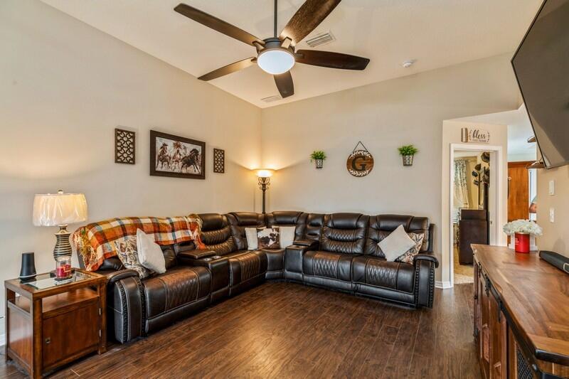 3152 Vaccari Court Crestview, FL 32539 - Photo 10 of 36 a living room with furniture and a flat screen tv