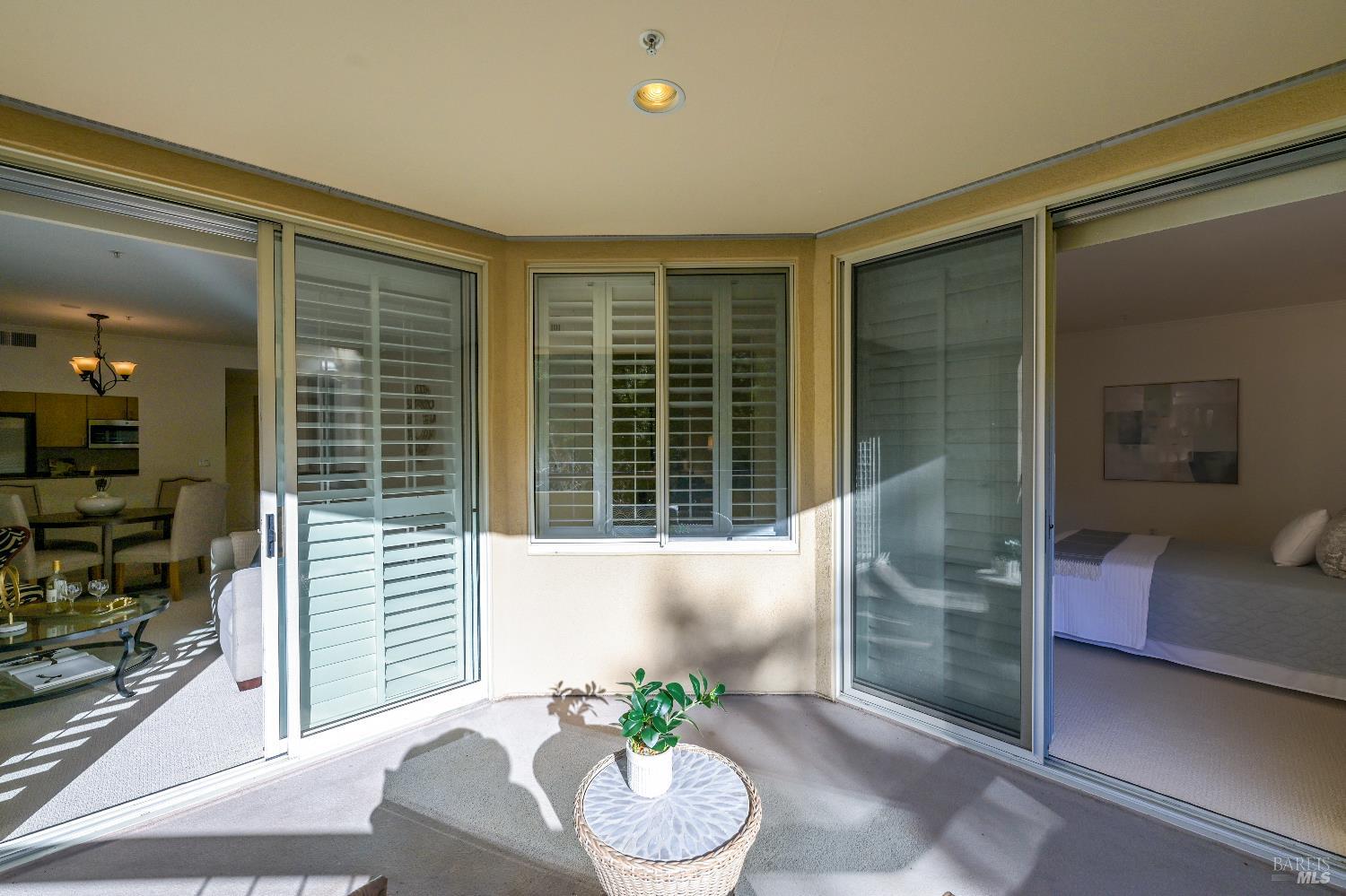 400 Deer Valley Road, Unit 3K San Rafael, CA 94903 - Photo 14 of 24 a living room with furniture and a potted plant