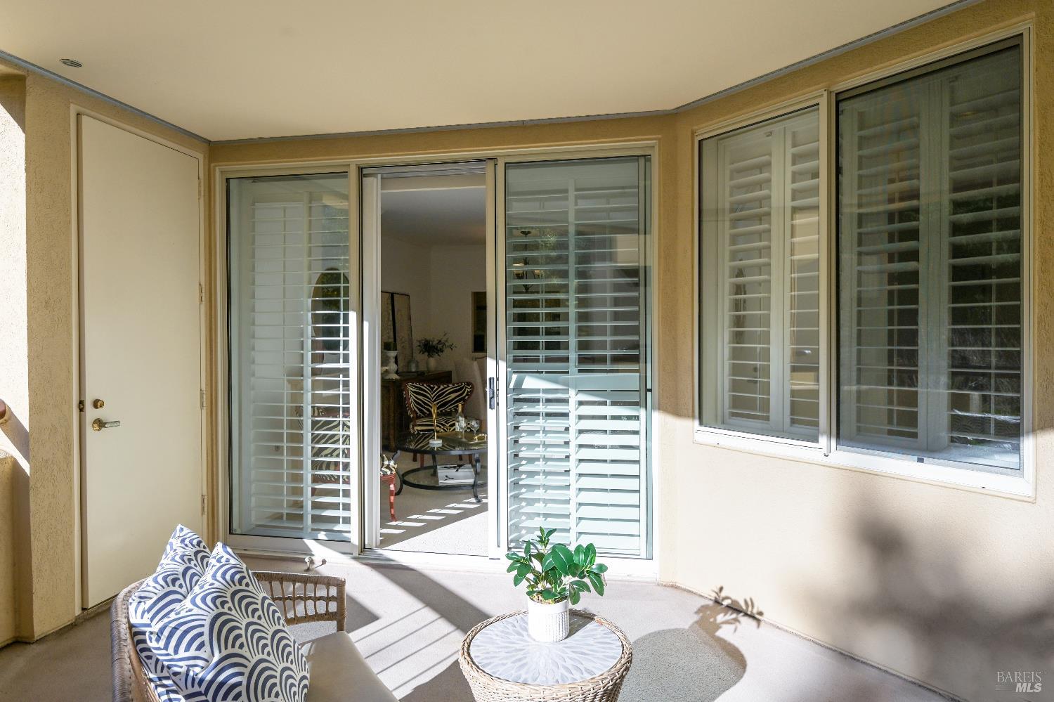 400 Deer Valley Road, Unit 3K San Rafael, CA 94903 - Photo 15 of 24 a living room with furniture and a potted plant