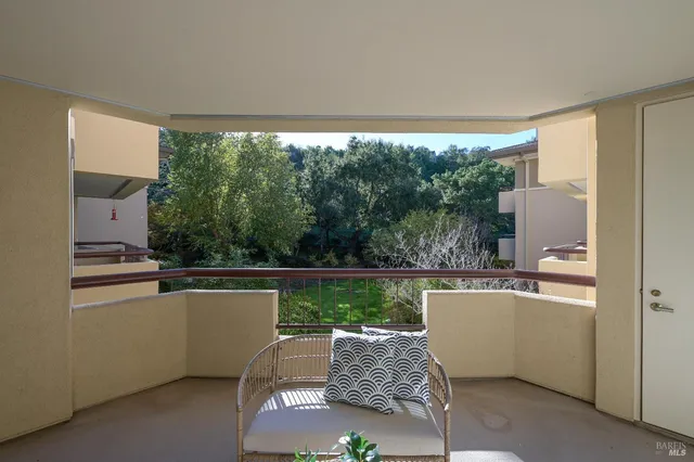 a living room with a floor to ceiling window and a couch