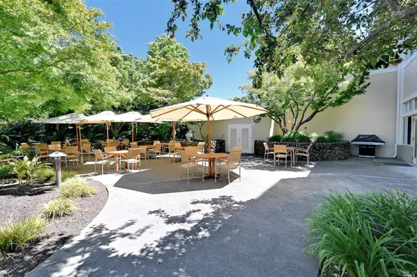 a view of a backyard with sitting area