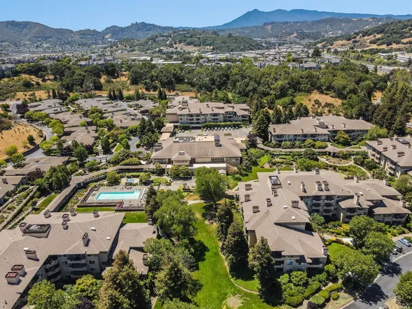 an aerial view of residential houses with outdoor space