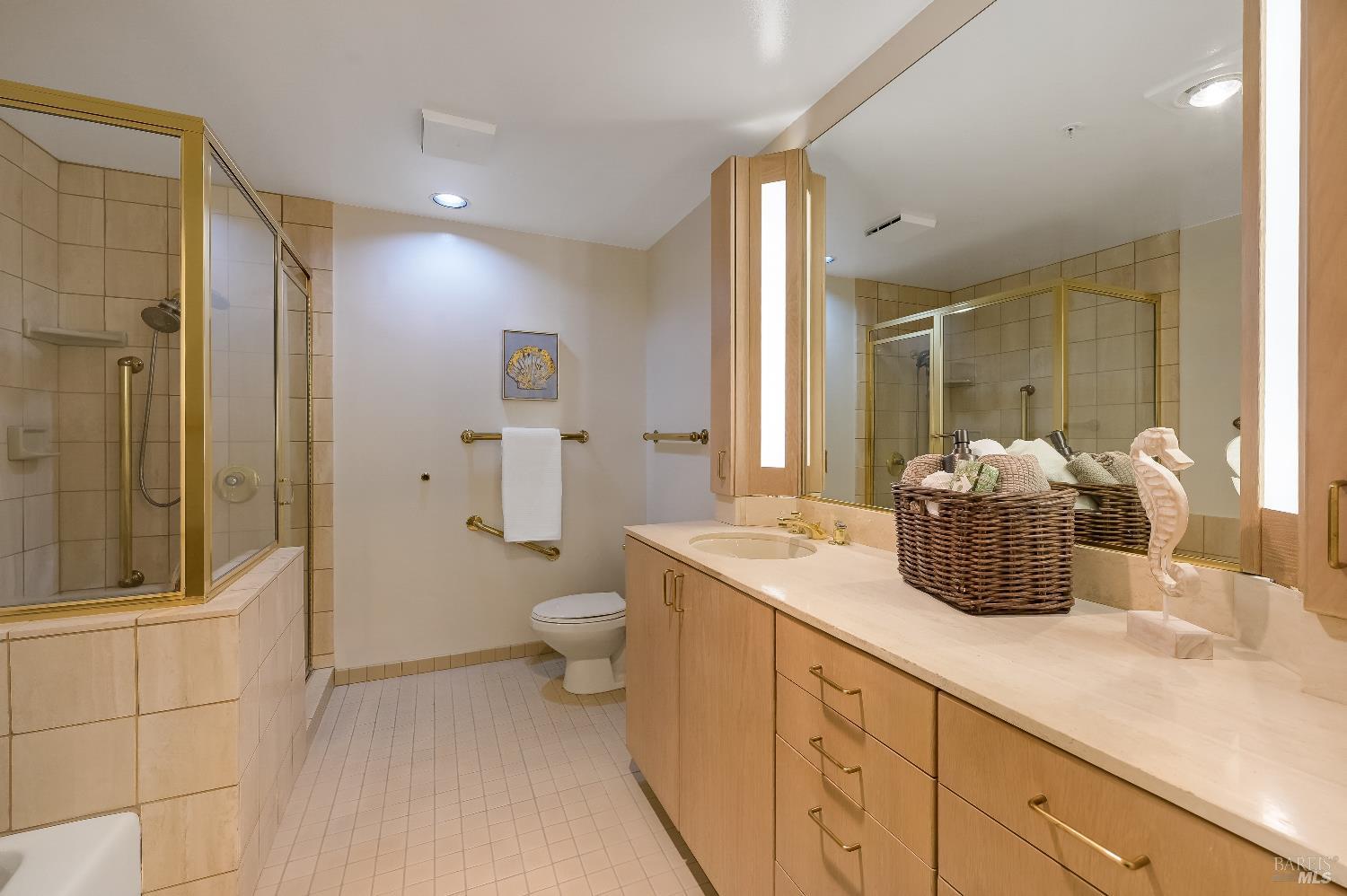400 Deer Valley Road, Unit 3K San Rafael, CA 94903 - Photo 9 of 24 a bathroom with a sink a toilet and shower