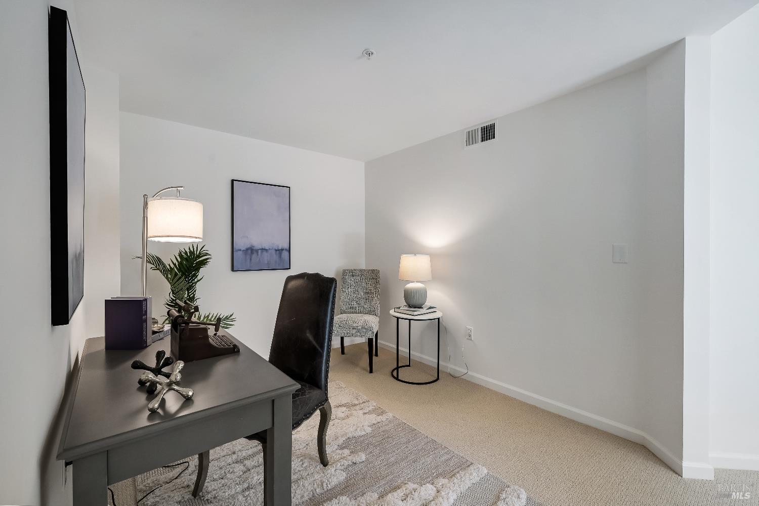 400 Deer Valley Road, Unit 3K San Rafael, CA 94903 - Photo 10 of 24 a living room with furniture and a mirror