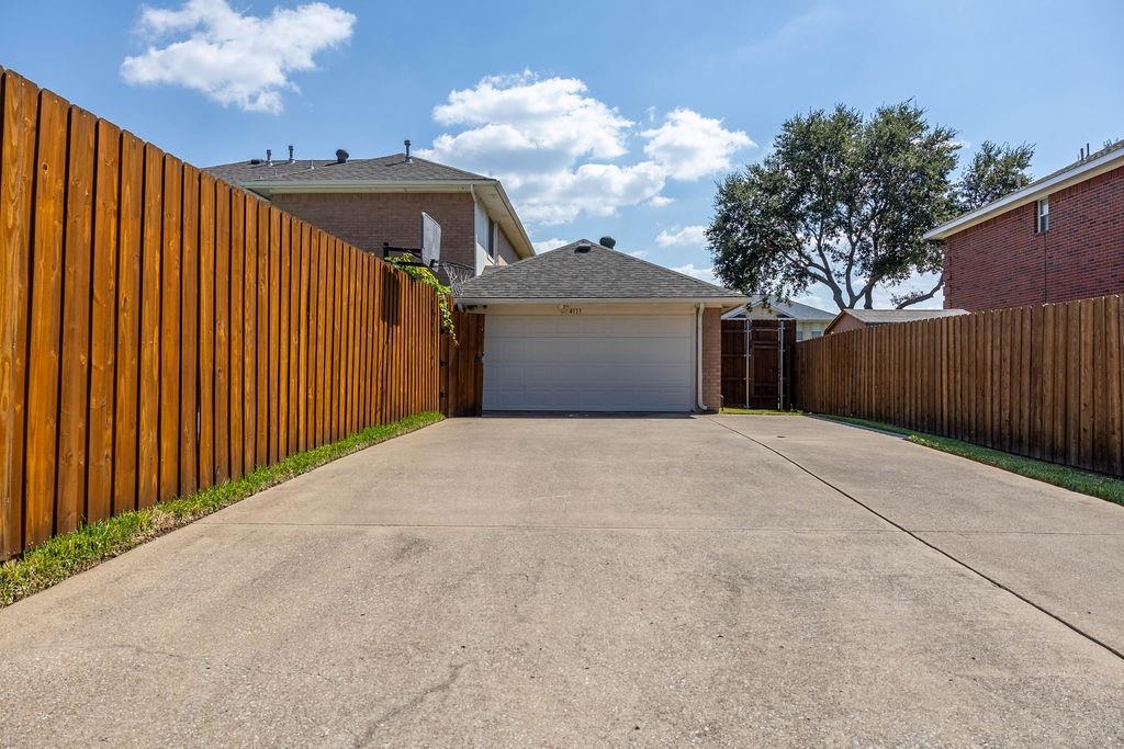 4113 Bluffpoint Road Rowlett, TX 75088 - Photo 39 of 39 Garage with concrete driveway
