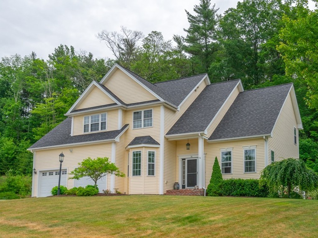 a front view of a house with a yard