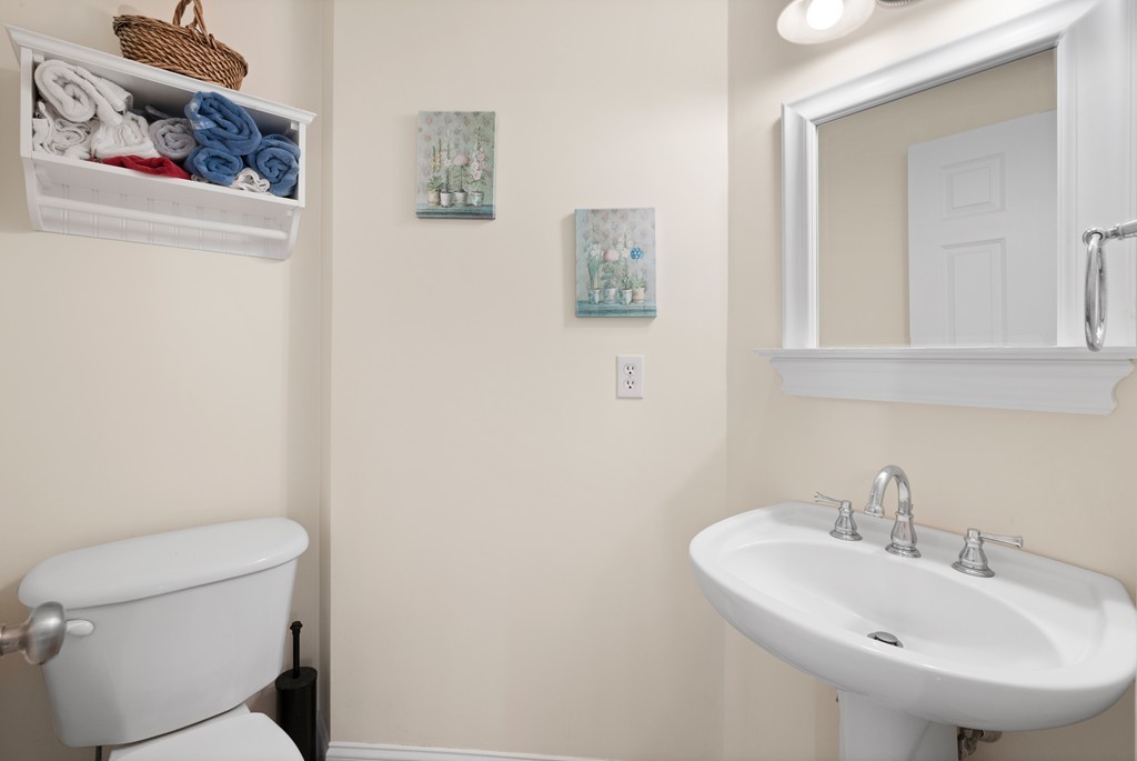 36 Draper Woods Road Sturbridge, MA 01518 - Photo 10 of 25 a bathroom with a sink a toilet and mirror