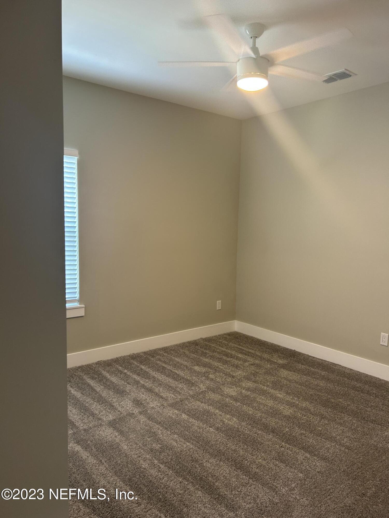 502 Twenty-First Street St. Augustine, FL 32084 - Photo 11 of 14 a view of an empty room with window