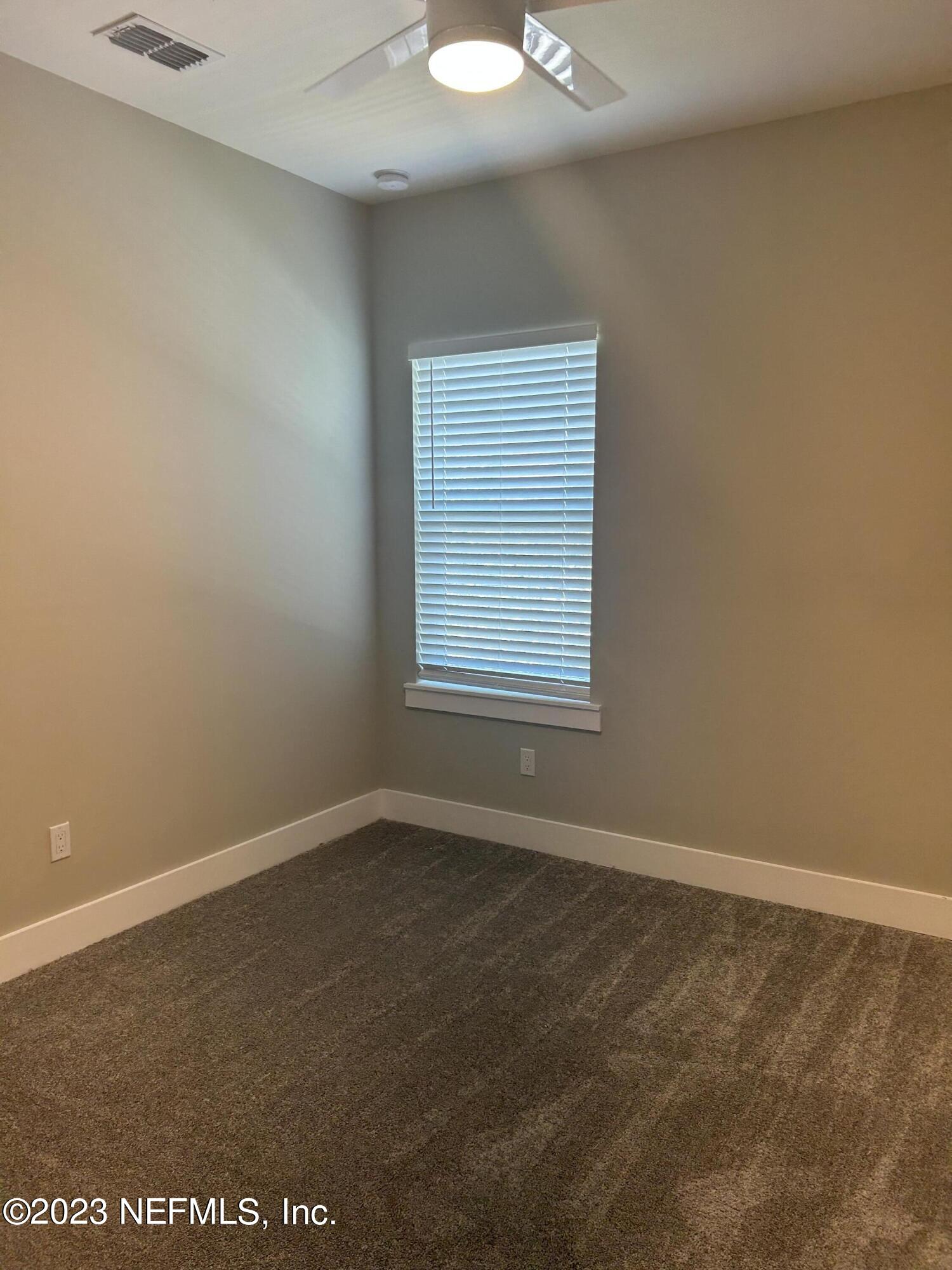 502 Twenty-First Street St. Augustine, FL 32084 - Photo 12 of 14 an empty room with a window