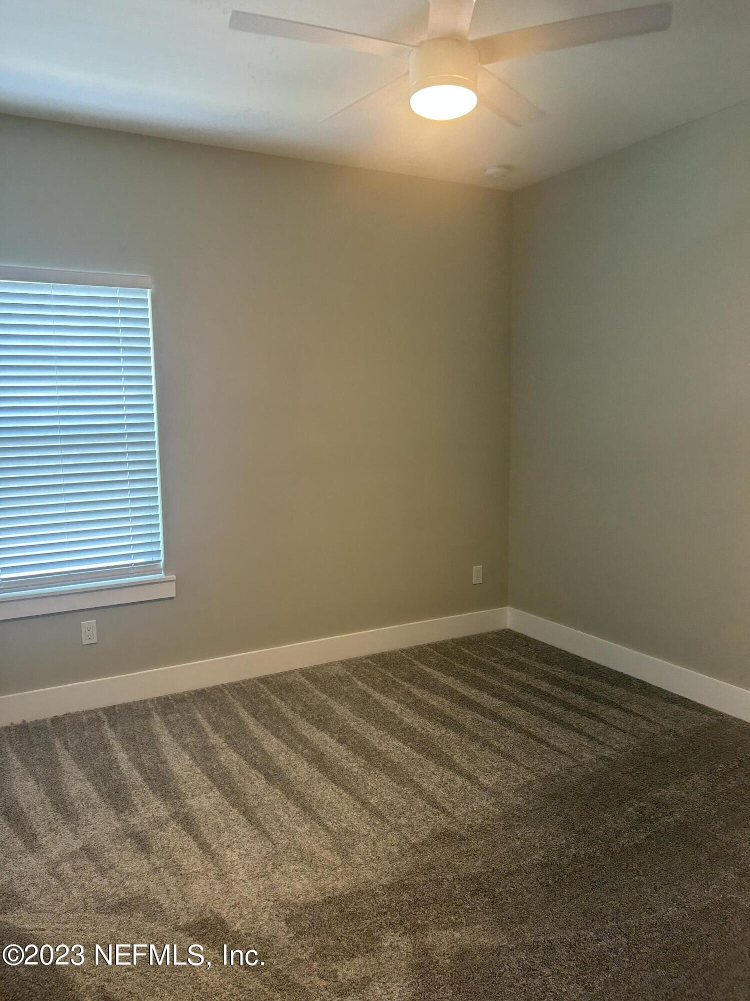 502 Twenty-First Street St. Augustine, FL 32084 - Photo 10 of 14 a view of an empty room with a window