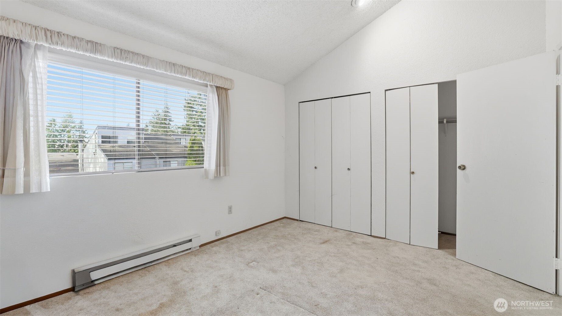 1850 Grant Avenue South, Unit D5 Renton, WA 98055 - Photo 21 of 25 a view of an empty room with a window