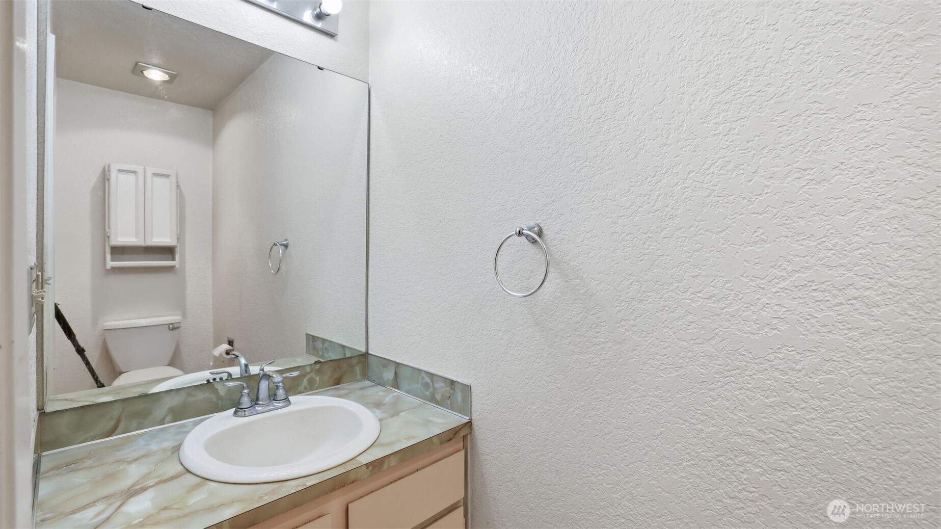 1850 Grant Avenue South, Unit D5 Renton, WA 98055 - Photo 24 of 25 a bathroom with a sink and a mirror