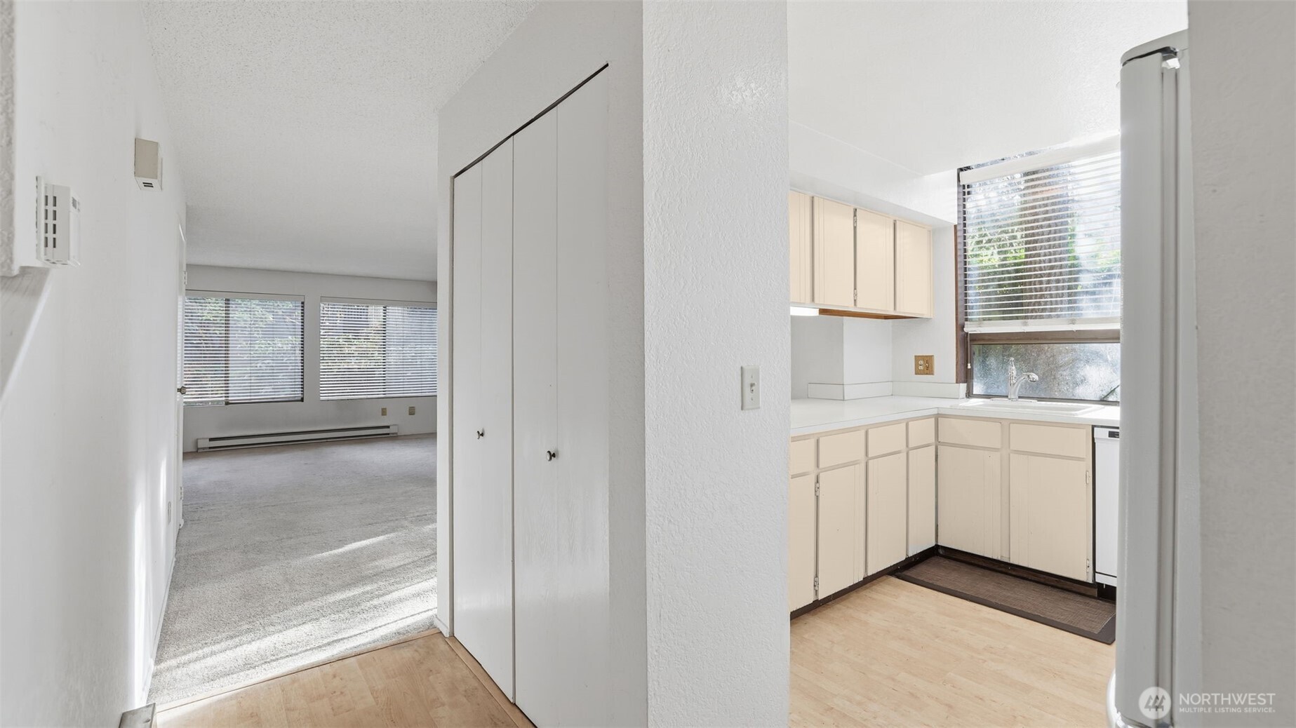 1850 Grant Avenue South, Unit D5 Renton, WA 98055 - Photo 10 of 25 a kitchen with white cabinets and sink