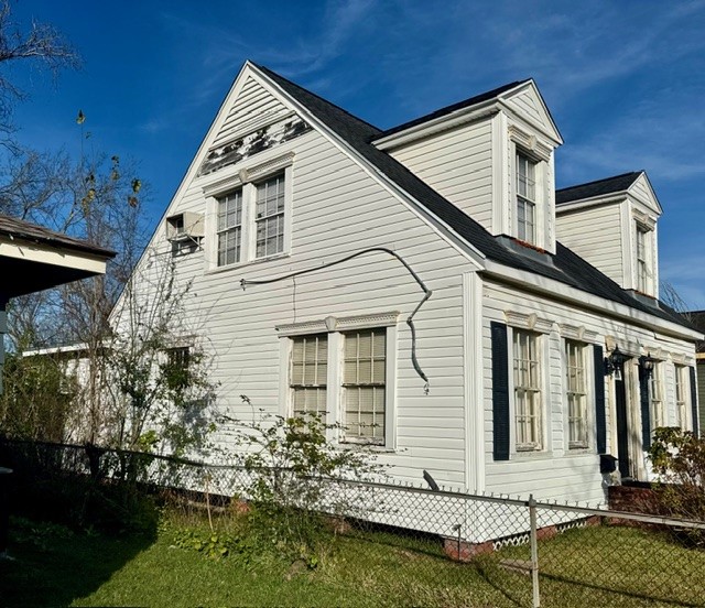 2320 Rusk Street Beaumont, TX 77702 - Photo 2 of 8 a front view of a house with a yard garage and outdoor seating