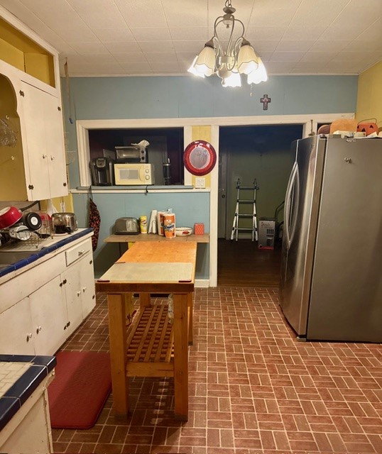2320 Rusk Street Beaumont, TX 77702 - Photo 3 of 8 a kitchen with stainless steel appliances a stove a refrigerator and cabinets