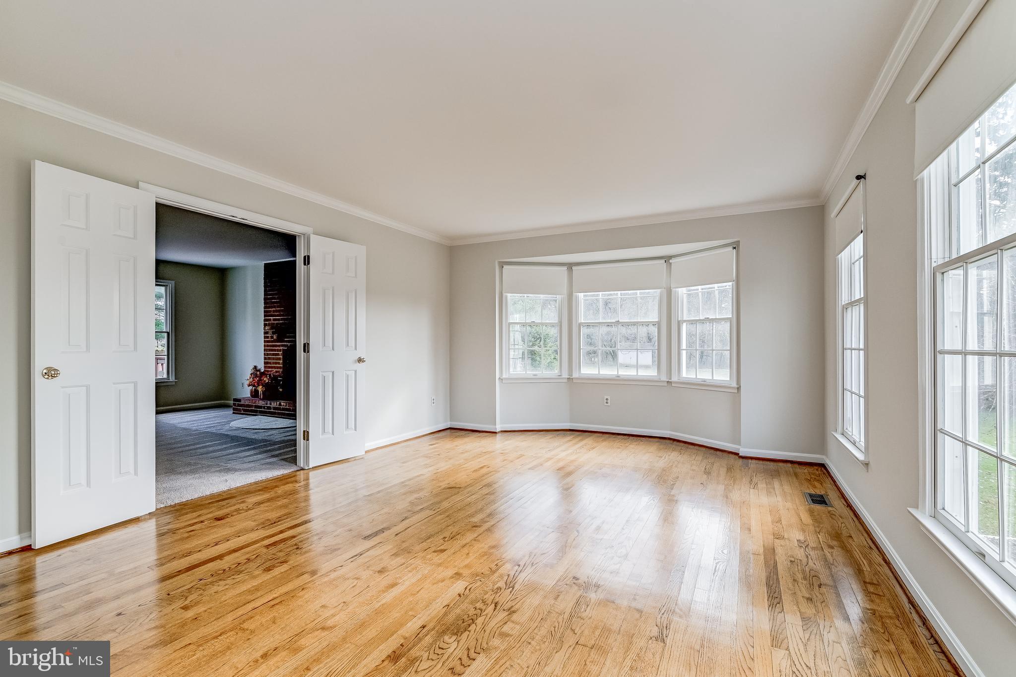 4739 Linthicum Road Dayton, MD 21036 - Photo 14 of 55 Living room with double doors to family room