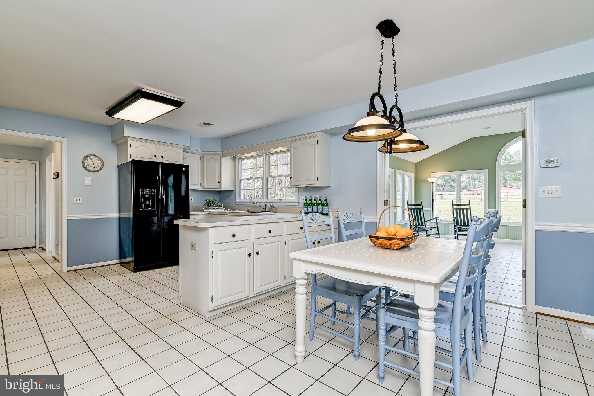 4739 Linthicum Road Dayton, MD 21036 - Photo 23 of 55 Breakfast room opens to sunroom