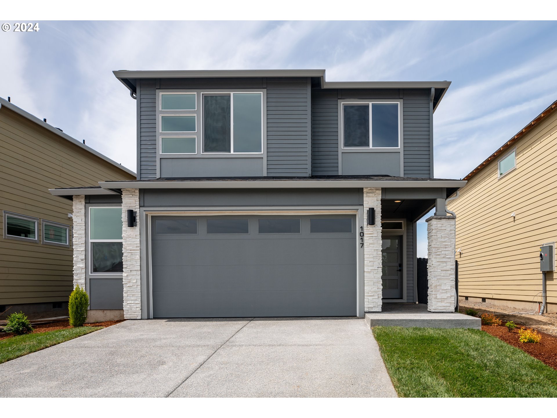 1017 South 46th Place Ridgefield, WA 98642 - Photo 1 of 23 a front view of a house with yard