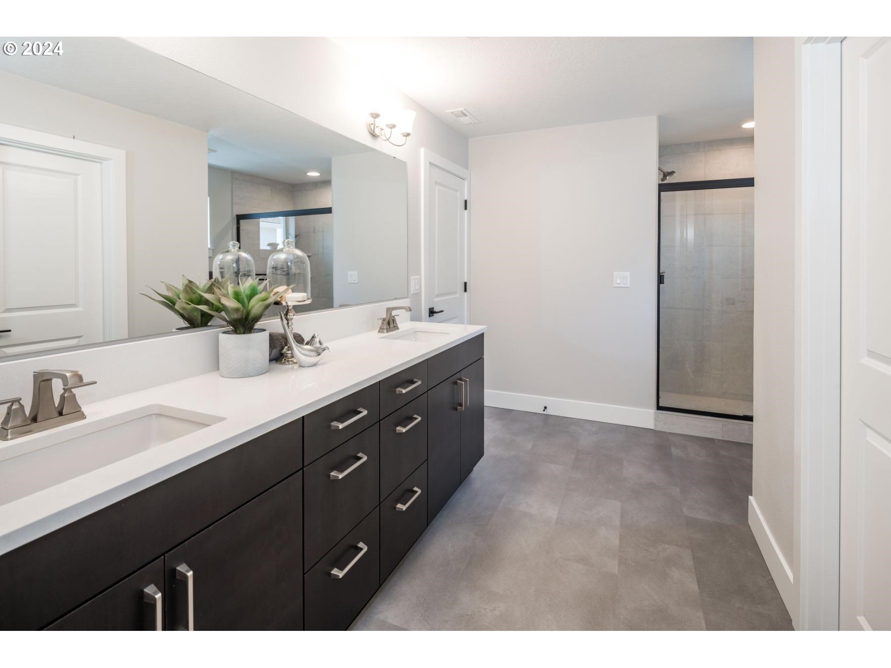 1017 South 46th Place Ridgefield, WA 98642 - Photo 11 of 23 a bathroom with a double vanity sink and mirror