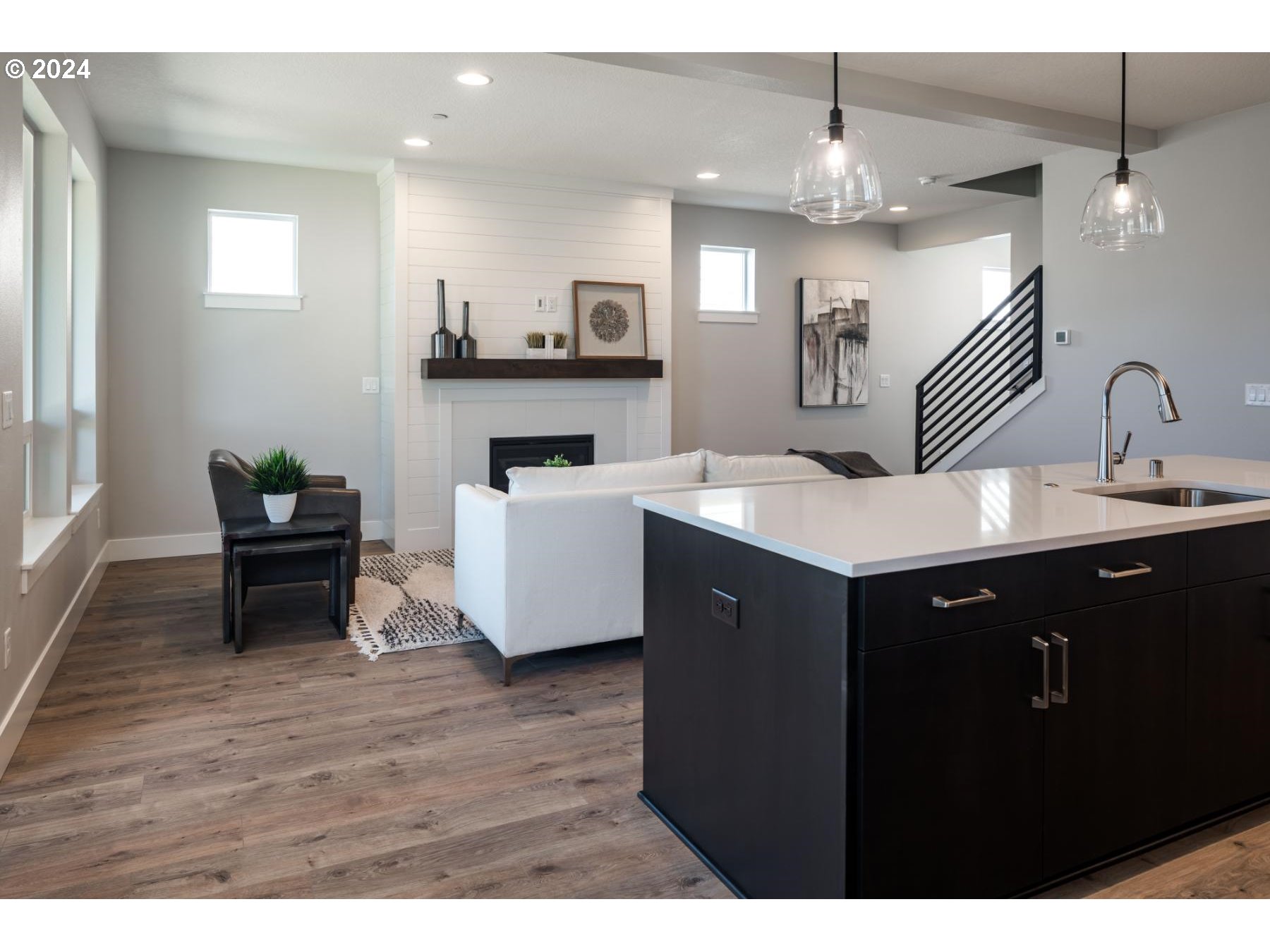 1017 South 46th Place Ridgefield, WA 98642 - Photo 5 of 23 a kitchen with a sink cabinets and wooden floor