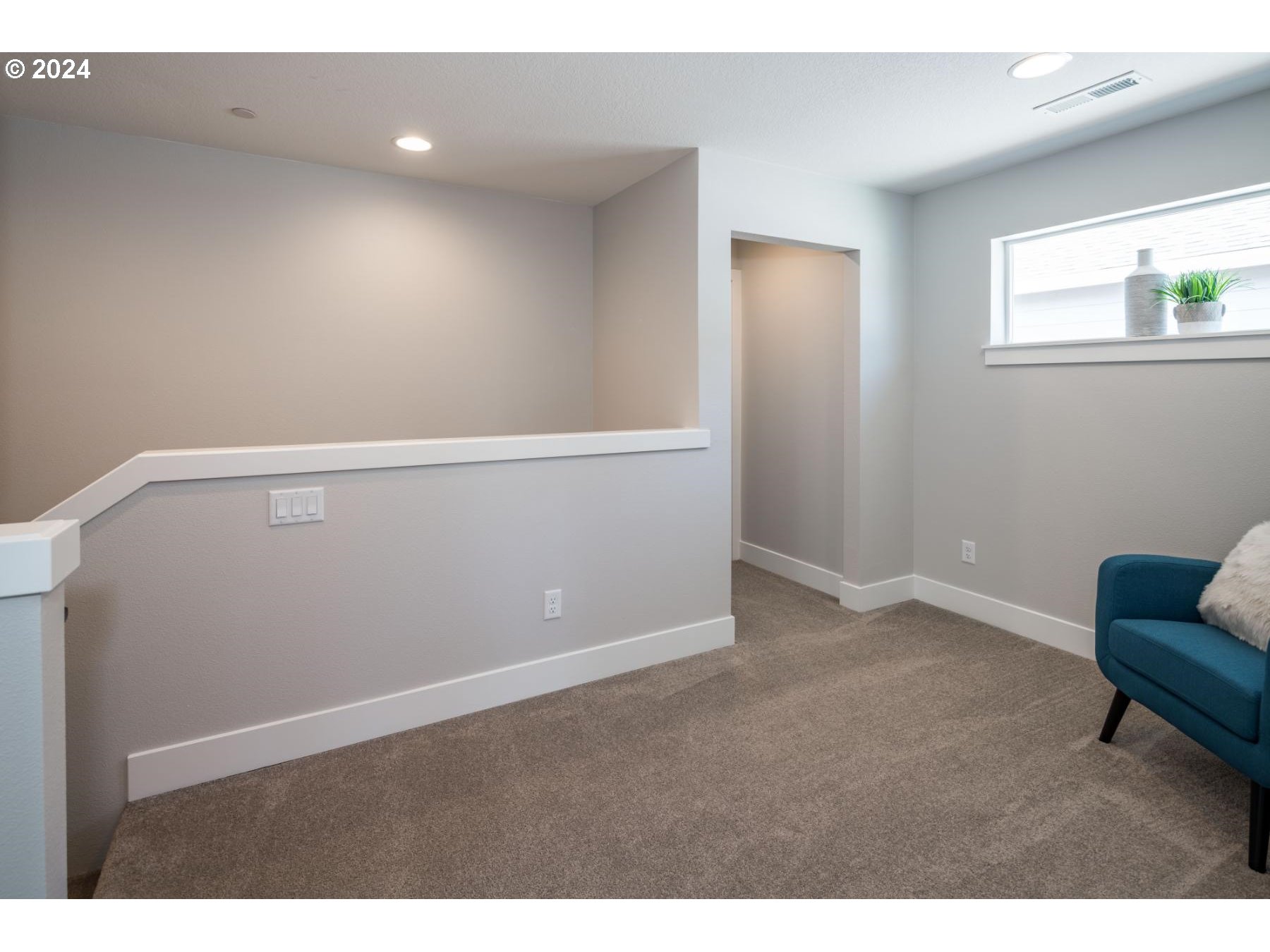 1017 South 46th Place Ridgefield, WA 98642 - Photo 8 of 23 a view of an empty room with wooden floor and a window