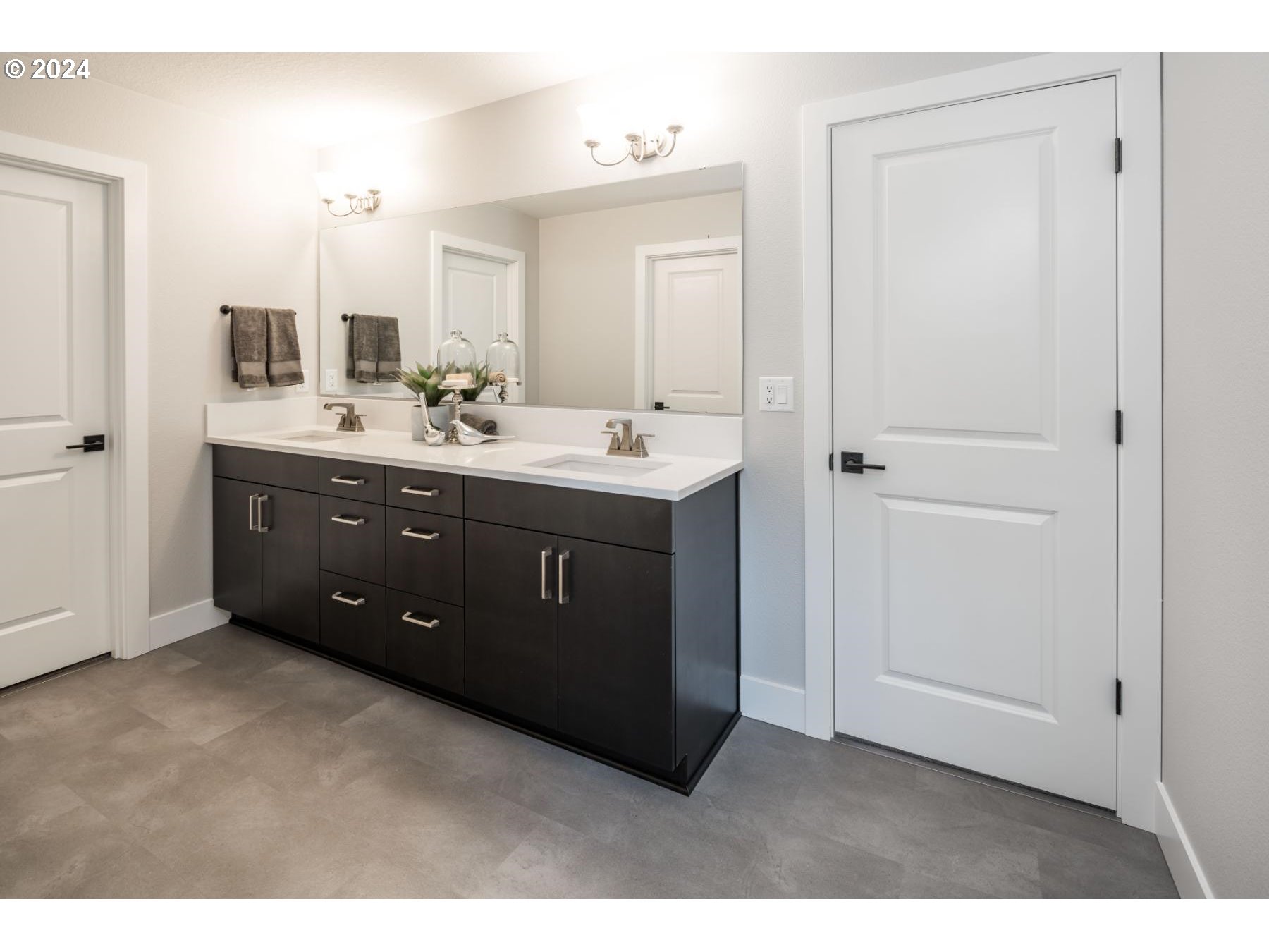 1017 South 46th Place Ridgefield, WA 98642 - Photo 10 of 23 a spacious bathroom with a double vanity sink and mirror