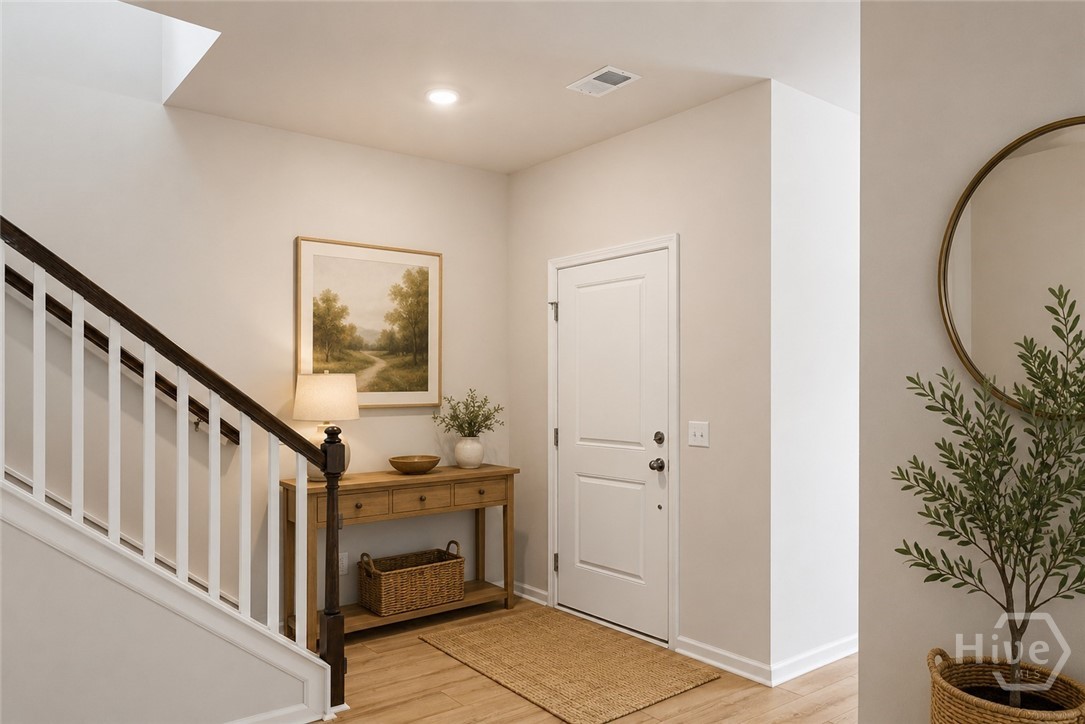 136 Binscombe Lane Pooler, GA 31322 - Photo 4 of 41 Foyer. *This photo has been virtually staged to illustrate the home’s design possibilities and room functionality. Furnishings and décor shown are digital renderings and are not included with the property.