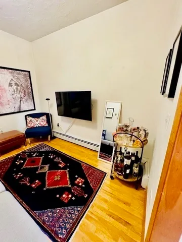 a room with furniture and a flat screen tv