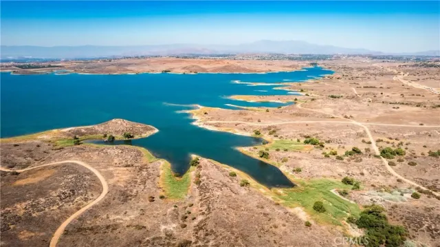 a view of a lake in middle of the forest