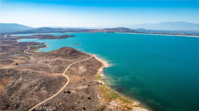a view of a lake with a yard