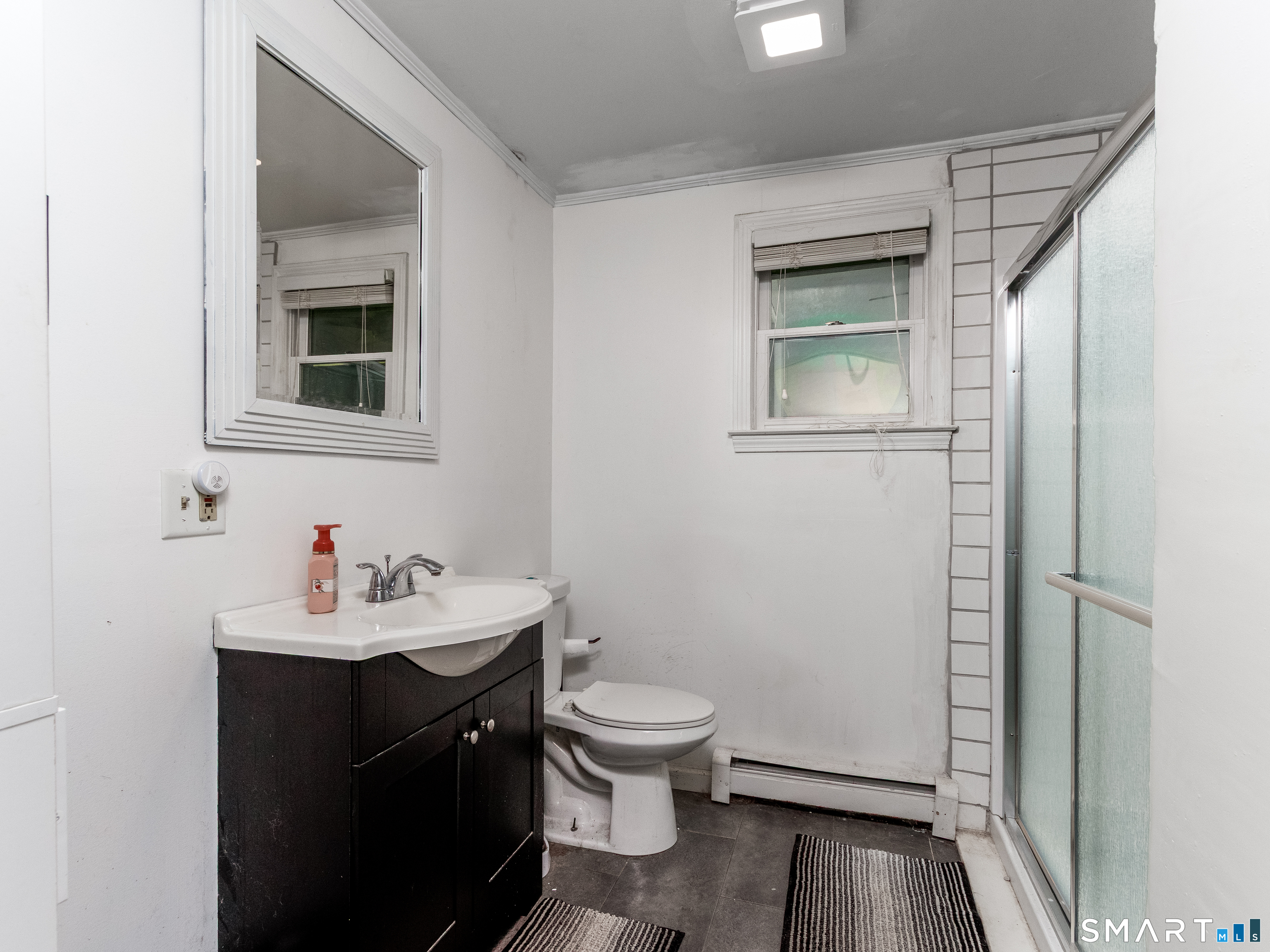 15 Bluff Avenue Clinton, CT 06413 - Photo 16 of 38 a bathroom with a sink toilet and vanity