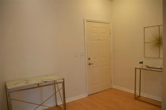a view of a storage & utility room with a door