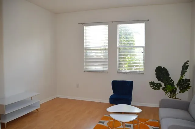 a view of front door with wooden floor