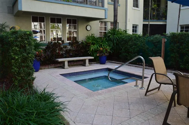 a view of a multi story building with swimming pool