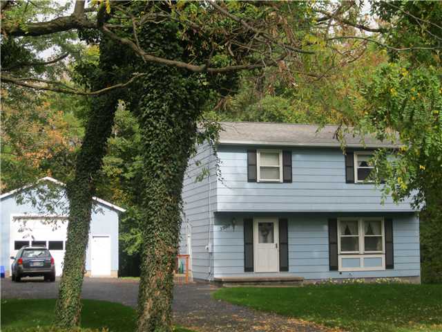 3990 Brick Schoolhouse Road Hamlin, NY 14464 - Photo 1 of 1 Exterior Front Mature woodd lot with 24 X 32 Barn