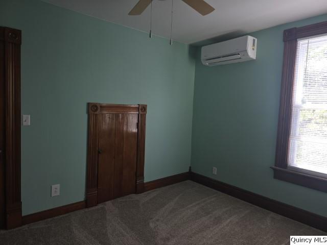 210 Main Street Carthage, IL 62321 - Photo 21 of 36 an empty room with windows