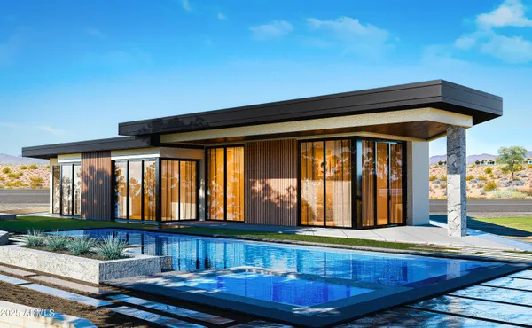 a view of a house with swimming pool and sitting area