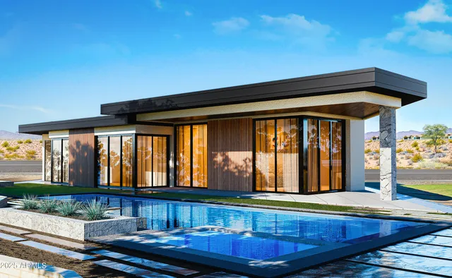 a view of a house with swimming pool and sitting area