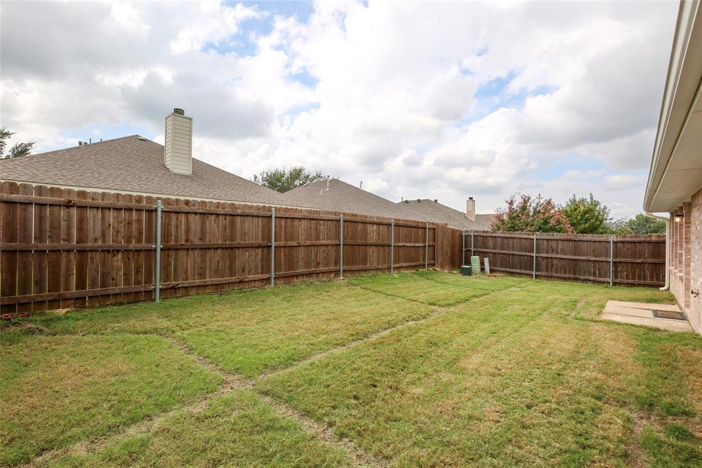5961 Cheyenne Way Frisco, TX 75034 - Photo 32 of 33 Expansive grass lawn with a full privacy fence