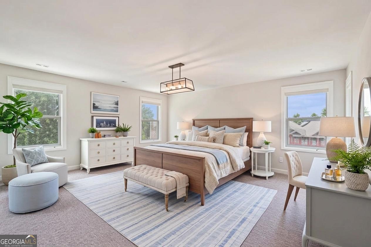 17 Lake Sydney Drive Dawsonville, GA 30534 - Photo 24 of 52 a spacious bedroom with a bed and a couch